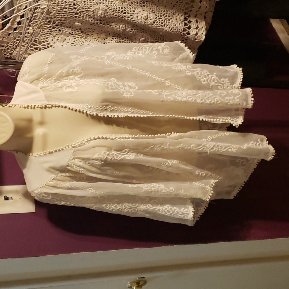 Lightweight cardigan sheer with beautiful designs on it
